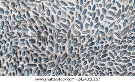 gravel stone mixed cement floor texture pattern. floor for reflexology massage 