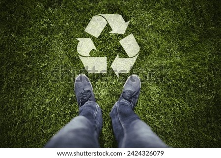 Person point of view green grass with recycle symbol. Concept people and ecology science.