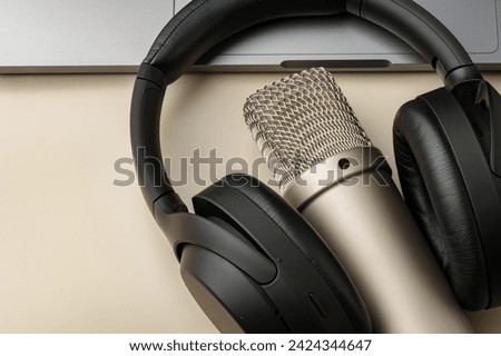 Headphones and microphone on the table close up
