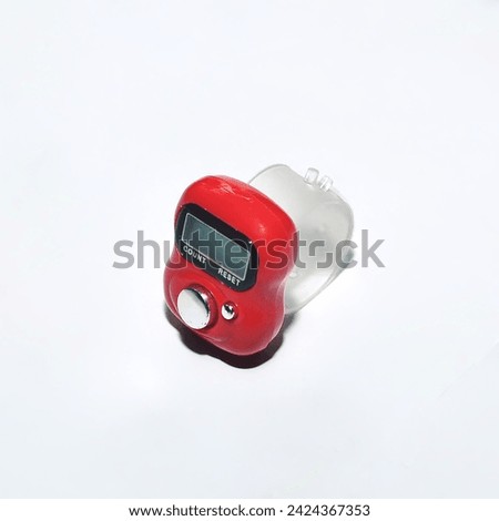 tally counter, A small counter made from red plastic, white background, object