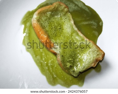 close-up of cheese bread with matcha lava isolated on a white background