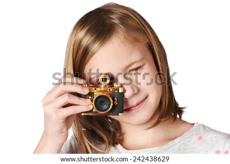 Girl photographer takes a picture retro camera isolated on white