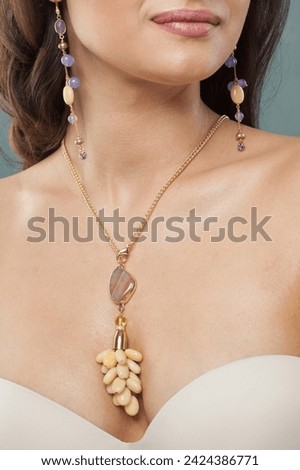 Charming jewelry model. Woman with bijou close up Royalty-Free Stock Photo #2424386771