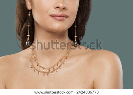 Gold jewelry model. Woman with bijou close up Royalty-Free Stock Photo #2424386773