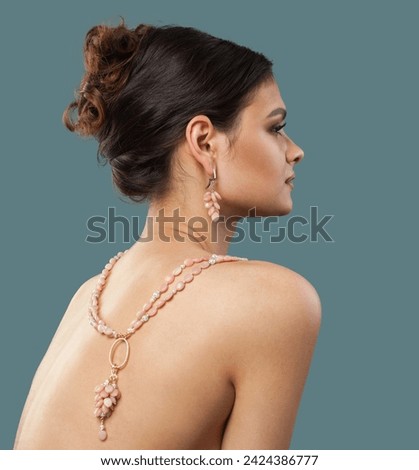Lovely jewelry model. Woman back with bijou sautoir rope necklace close up Royalty-Free Stock Photo #2424386777