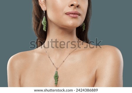 Green aventurine or chrysoprase jewelry model. Woman with bijou close up Royalty-Free Stock Photo #2424386889