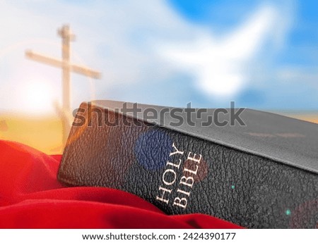 Bright sunlight, holy bible book and cross silhouette