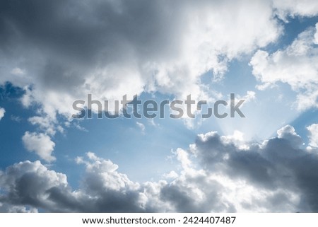 Atmospheric conditions: Partly cloudy sky with the presence of stormy clouds Royalty-Free Stock Photo #2424407487