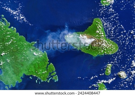 Plume from Ambrym Volcano. A plume from an active volcano in the Vanuatu archipelago extended over the South Pacific Ocean. Elements of this image furnished by NASA. Royalty-Free Stock Photo #2424408447