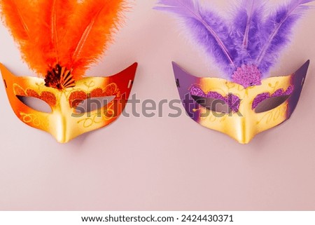 Happy Purim carnival. Carnival mask for Mardi Gras celebration isolated on purple background banner design with copy space, jewish holiday, Purim in Hebrew holiday carnival ball, Venetian mask