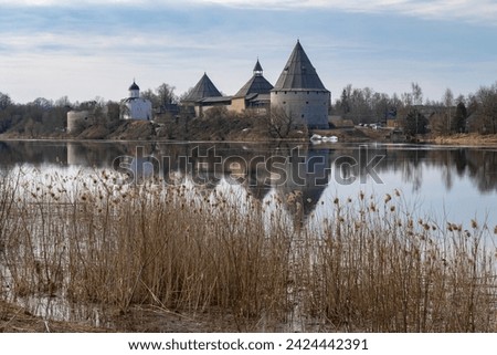 April on the Volkhov river. Landscape with the ancient Staraya Ladoga fortress. Leningrad region, Russia Royalty-Free Stock Photo #2424442391