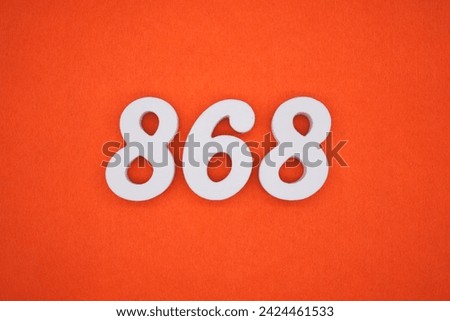 Orange felt is the background. The numbers 868 are made from white painted wood.