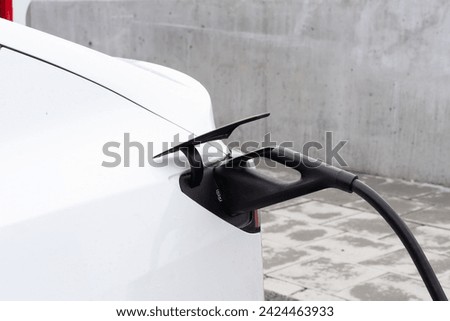 Supercharger station. The supercharger offers fast recharging of the electric vehicles. Royalty-Free Stock Photo #2424463933