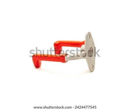 Small zinc alloy U-Hook with red finishes steel handle isolated on white background, garage storage utility U-Hook mount to drywall, wood stud using screw, clipping path and copy space. Industrial