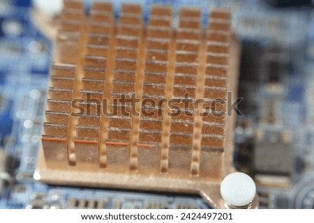 A closeup of a computer main board electronic motherboard, the main printed circuit board (PCB) in general-purpose computers and other expandable systems, allows communication of electronic components Royalty-Free Stock Photo #2424497201