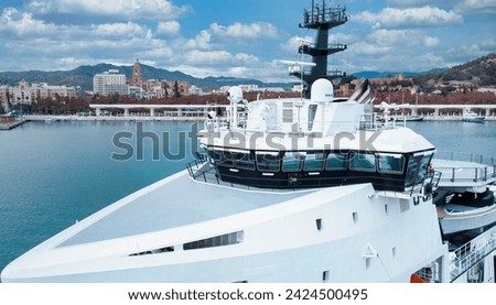 luxury modern yacht transport at port Royalty-Free Stock Photo #2424500495