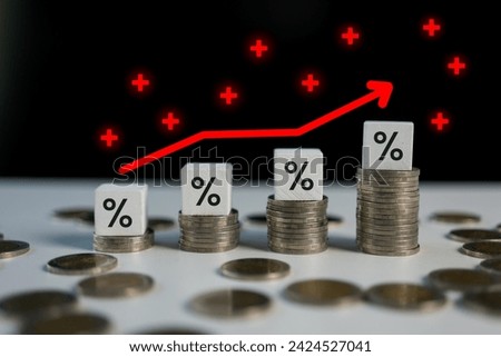 Economic crash and inflation. Interest rates symbol. A wooden cube with an arrow symbolizes that the interest rates are going up. Business interest rates concept