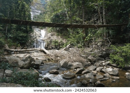 suspension bridge at Gunung Stong waterfall, located at Dabong, Kelantan, Malaysia