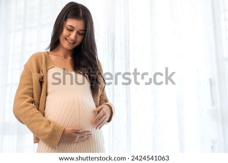 Happy smiling Mother woman hugging and smiling expecting with pregnancy hold baby in belly, woman pregnant, birth, preparation, maternity, care with childbirth at home.Love of family