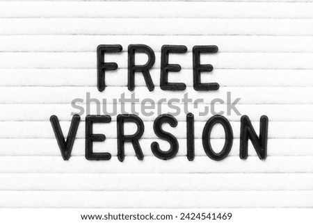 Black color letter in word free version on white felt board background Royalty-Free Stock Photo #2424541469