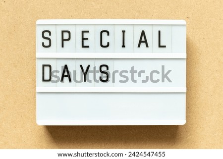 Lightbox with word special days on wood background