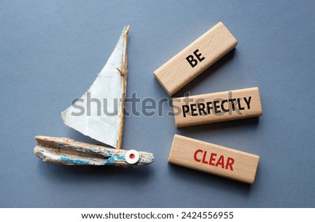 Be perfectly clear symbol. Concept words Be perfectly clear on wooden blocks. Beautiful grey background with boat. Business and Be perfectly clear concept. Copy space Royalty-Free Stock Photo #2424556955