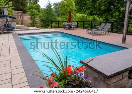 Dive into luxury with breathtaking backyard pool designs. Transform your outdoor space into a paradise with our stunning pool photography Royalty-Free Stock Photo #2424568417