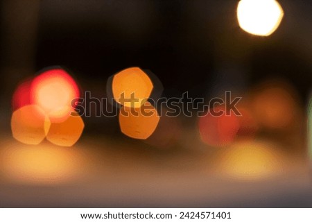 Bright red and yellow lights close up, blurred background