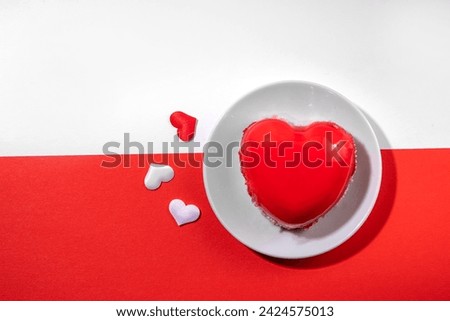 Valentine's day holiday symbol red heart portioned cake on a white-red background, top view Royalty-Free Stock Photo #2424575013
