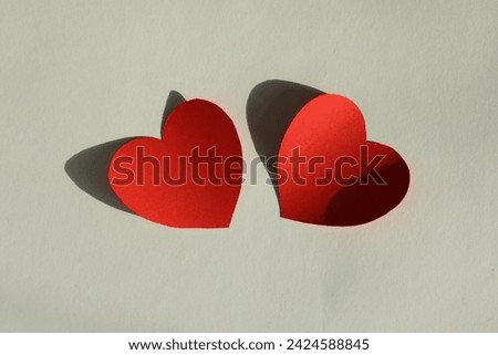 Paper hearts on light grey background, flat lay