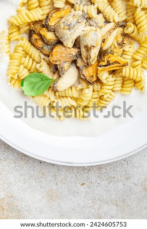 fusilli pasta with mussels seafood Mediterranean cuisine tasty fresh eating cooking appetizer meal food snack on the table copy space food background rustic top view