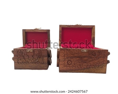 A unique and beautiful handmade jewellery box with hand-engraved designs that look different from every angle. The box is made of wood and has a glossy finish.