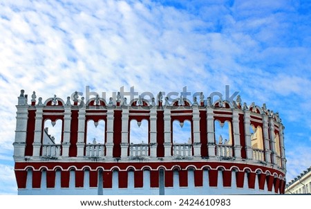The Kutafya Tower of the Moscow Kremlin is an ancient defensive structure of red and white color against the sky. Brick architecture. Royalty-Free Stock Photo #2424610983