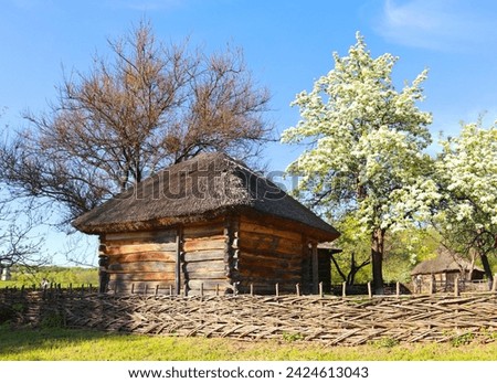 Traditional Ukrainian wooden barn in Pirogovo, Ukraine Royalty-Free Stock Photo #2424613043