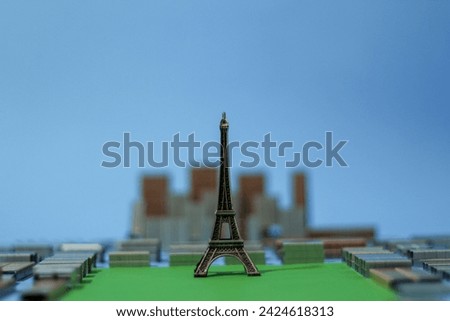 Paris, France mock-up built from Eiffel Tower toy model and stapler ammunition representing aerial view on Mars fields illustrating Parisian lifestyle and favorite tourists spot for photos.