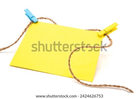 Greeting card hangs on a rope with clothespins. Copy space. Free space for text. Yellow and blue are the colors of the national flag of Ukraine.