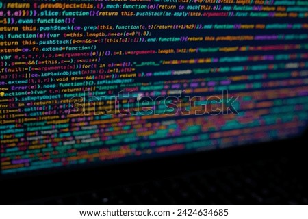 Programming JavaScript during an intense night, immersed in the comforting glow of the screen, where lines of code come to life with each keystroke. In this digital realm, time seems to stand still as Royalty-Free Stock Photo #2424634685