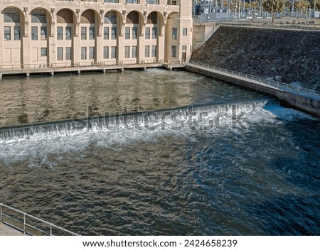 The Pit River flows under Powerhouse One in the northern Sierras of California, USA Royalty-Free Stock Photo #2424658239