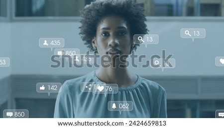 Image of social media icons and data processing over biracial businesswoman. Global business, finances, computing and data processing concept digitally generated image.