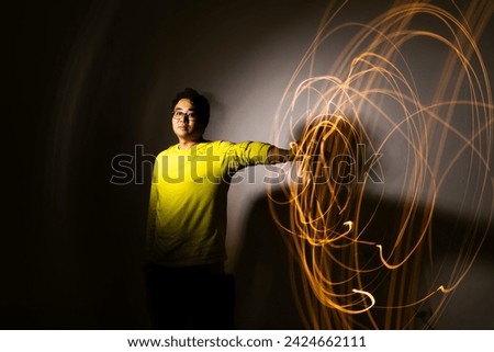 This is a photo of light painting taken with long exposure. Royalty-Free Stock Photo #2424662111
