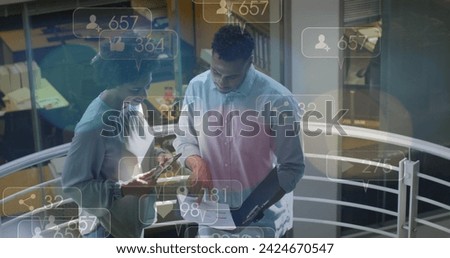 Image of financial data processing over diverse business people in office. Global business, finances, computing and data processing concept digitally generated image.