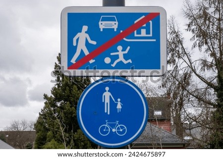 A road sign informing about the area where children play, watch out for children,end of the children's play area