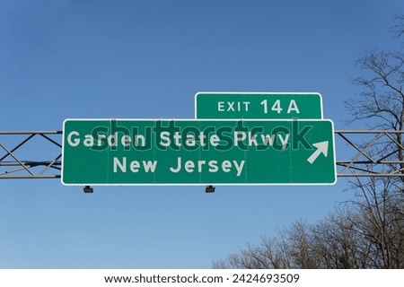 sign on I-287 I-87 Governor Thomas E. Dewey Thruway in Chestnut Ridge, New York for Exit 14A to the Garden State Parkway in New Jersey Royalty-Free Stock Photo #2424693509