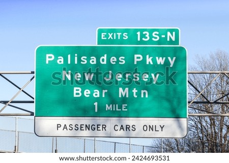 sign on I-287 I-87 NY State Thruway in Nanuet, New York for Exit 13 S-N for Palisades Parkway New Jersey and Bear Mountain Royalty-Free Stock Photo #2424693531