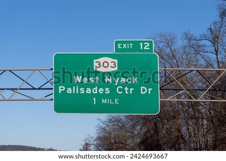 sign on I-287 I-87 NY State Thruway in West Nyack, New York for Exit 12 for NY-303 Palisades Center Drive and West Nyack Royalty-Free Stock Photo #2424693667