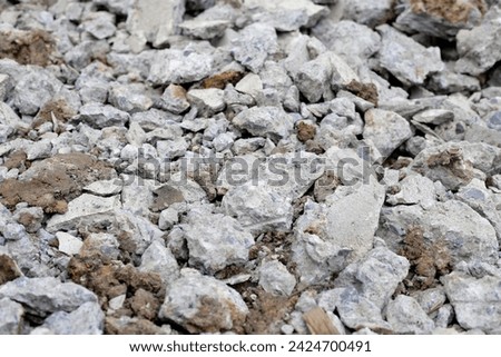 Broken concrete, Piles of rubble after house demolition Royalty-Free Stock Photo #2424700491