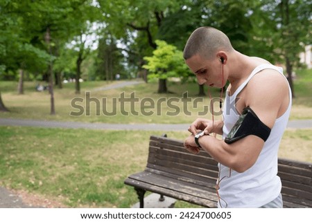 Athlete checking his smart watch