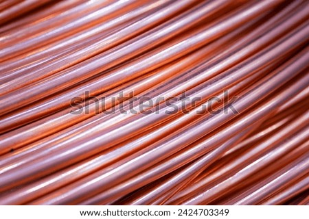 Twisted copper cable, close-up. Closeup of spiral copper cable with soft focus background. Copper wire randomly wound into a coil