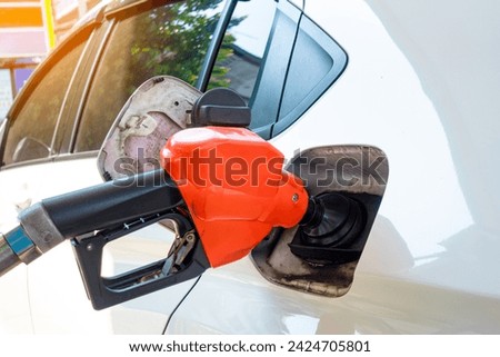 Refuel the car at the refueling point. Energy Concepts Gasoline Gasohol Alternative Energy Royalty-Free Stock Photo #2424705801