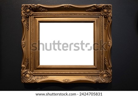 Blank white mockup template of a vintage retro style painting frame in golden color. Old and luxury Rococo decorative picture frame, empty background texture with antique French style, mounted on wall